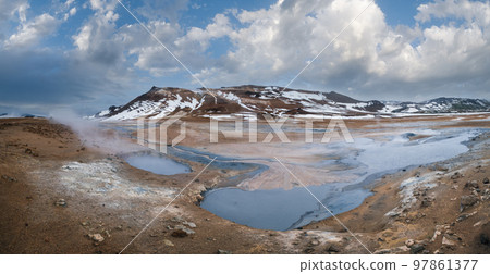 The Namafjall Geothermal Area, Iceland, on the east side of Lake Myvatn. At this area, also known as Hverir, are many smoking fumaroles, boiling mud pots and sulphur crystals. The Namafjall Geothermal Area, Iceland, on the east side of Lake Myvatn. At this area, also known as Hverir, are many smoking fumaroles, boiling mud pots and sulphur crystals. 97861377