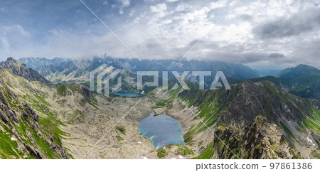 Tatra Mountain view to group of glacial lakes from path Kasprowy Wierch to Swinica mount, Poland. 97861386
