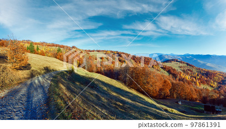 Rural road in autumn in mountain. Rural road in autumn in mountain. 97861391