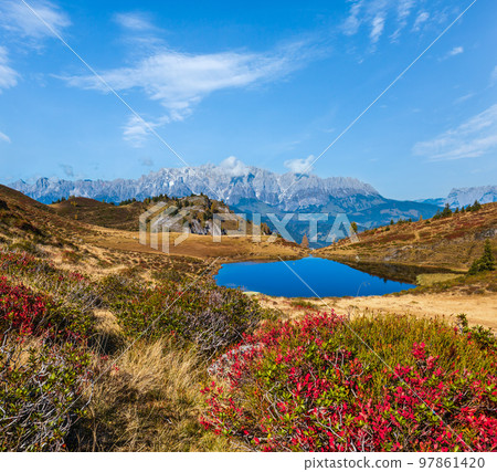 Autumn alpine Kleiner Paarsee or Paarseen lake, Land Salzburg, Austria. Alps Hochkonig rocky mountain group view in far. Autumn alpine Kleiner Paarsee or Paarseen lake, Land Salzburg, Austria. Alps Hochkonig rocky mountain group view in far. 97861420