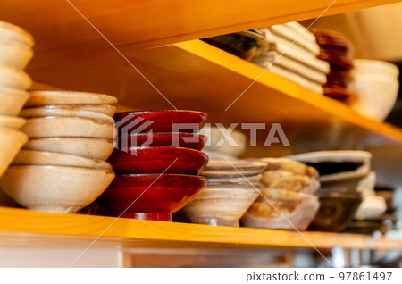 Bowls and plates on the cupboard, pottery Bowls and plates on the cupboard, pottery 97861497
