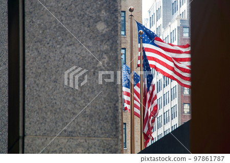Flags of the United States waving in the wind in New York City 97861787