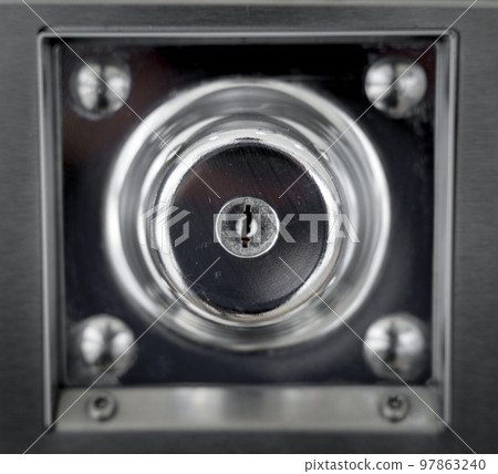 Keyholes. close up detail modern round metal key hole steel door, security safety protect Keyholes. close up detail modern round metal key hole steel door, security safety protect 97863240