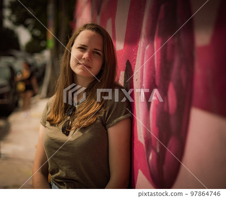 Street style photo shoot with a young pretty woman in the colorful streets of Miami Street style photo shoot with a young pretty woman in the colorful streets of Miami 97864746