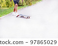 young man riding a skateboard left direction of movement close-up 97865029