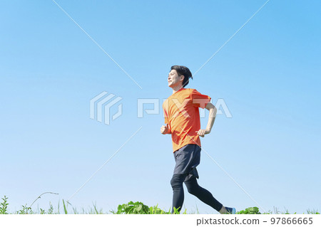 Man running outdoors copy space available Man running outdoors copy space available 97866665