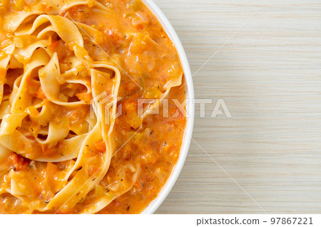 fettuccine pasta with creamy tomato sauce fettuccine pasta with creamy tomato sauce 97867221
