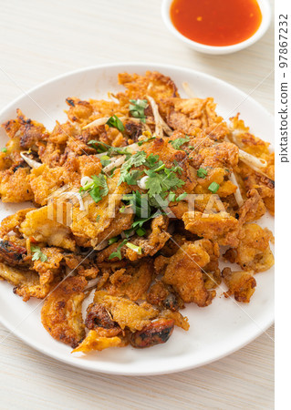 Crispy fried mussel pancake with egg Crispy fried mussel pancake with egg 97867232
