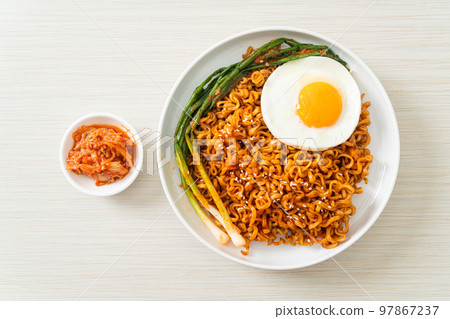 dried Korean spicy instant noodles with fried egg dried Korean spicy instant noodles with fried egg 97867237