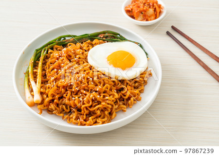 dried Korean spicy instant noodles with fried egg 97867239