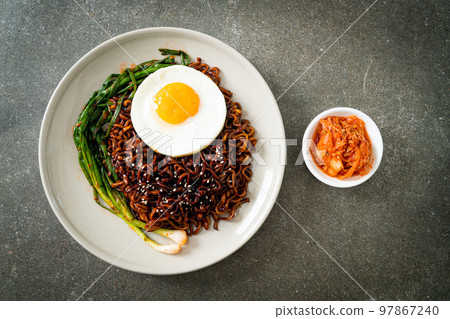 dried Korean spicy black sauce instant noodles with fried egg and kimchi dried Korean spicy black sauce instant noodles with fried egg and kimchi 97867240