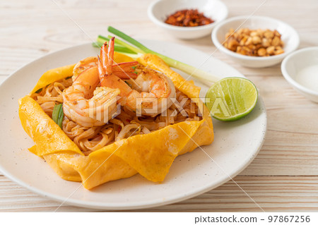 Thai stir fried noodles with shrimps and egg wrap (Pad Thai) Thai stir fried noodles with shrimps and egg wrap (Pad Thai) 97867256
