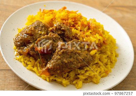 Beef Biryani or Curried rice and beef - Thai-Muslim version of Indian biryani, with fragrant yellow rice and beef Beef Biryani or Curried rice and beef - Thai-Muslim version of Indian biryani, with fragrant yellow rice and beef 97867257