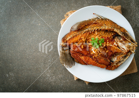 Fried Sea Bass Fish with Garlic 97867515