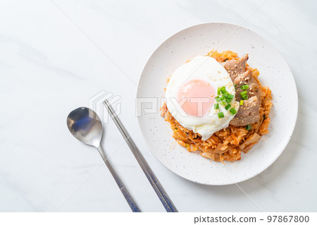 Kimchi fried rice with fried egg and pork 97867800