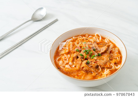 Korean udon ramen noodles with pork in kimchi soup Korean udon ramen noodles with pork in kimchi soup 97867843