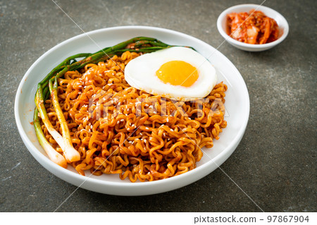 dried Korean spicy instant noodles with fried egg dried Korean spicy instant noodles with fried egg 97867904