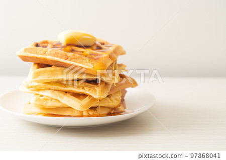waffle stack with butter and honey waffle stack with butter and honey 97868041