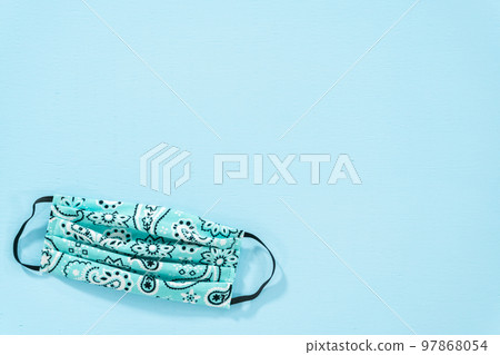 Homemade face masks for coronavirus outbreak on a blue background. Homemade face masks for coronavirus outbreak on a blue background. 97868054