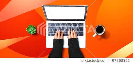 Person using a laptop computer 97868561