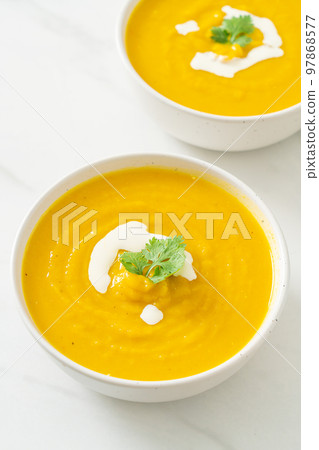 pumpkin soup in white bowl pumpkin soup in white bowl 97868577