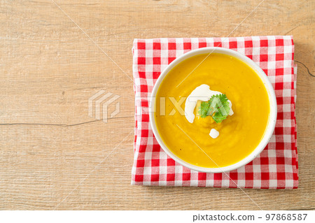 pumpkin soup in white bowl pumpkin soup in white bowl 97868587