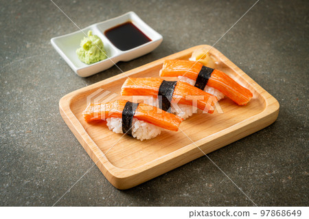 Crab Stick Sushi on wood plate 97868649