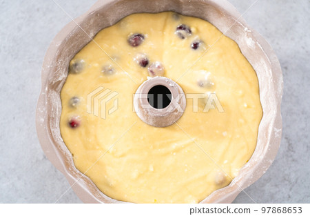 Cake batter in bundt cake pan ready for baking. Cake batter in bundt cake pan ready for baking. 97868653