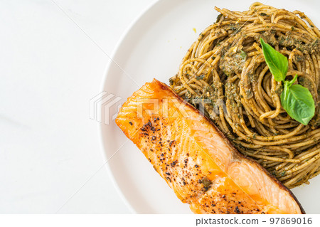 pesto spaghetti pasta with grilled salmon 97869016