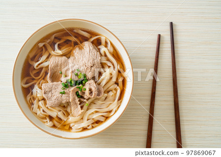 homemade udon noodles with pork in soy or shoyu soup 97869067