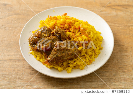 Beef Biryani or Curried rice and beef - Thai-Muslim version of Indian biryani, with fragrant yellow rice and beef 97869113
