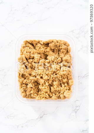 Light brown sugar on a marble counter top. Light brown sugar on a marble counter top. 97869320
