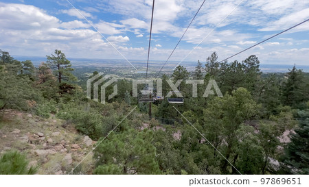 Ski lift ride at the Cheyenne Mountain Zoo during the summer. Ski lift ride at the Cheyenne Mountain Zoo during the summer. 97869651