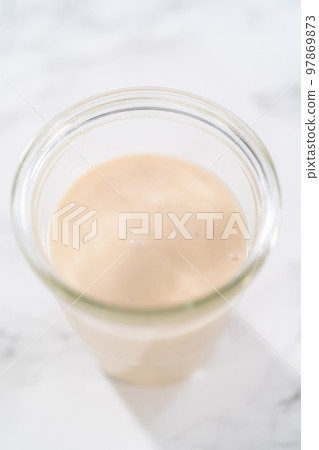 Lemon glaze. Lemon glaze in a glass jar. Lemon glaze. Lemon glaze in a glass jar. 97869873