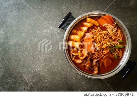Budae Jjigae or Budaejjigae (Army stew or Army base stew). It is loaded with Kimchi, spam, sausages, ramen noodles and much more Budae Jjigae or Budaejjigae (Army stew or Army base stew). It is loaded with Kimchi, spam, sausages, ramen noodles and much more 97869971