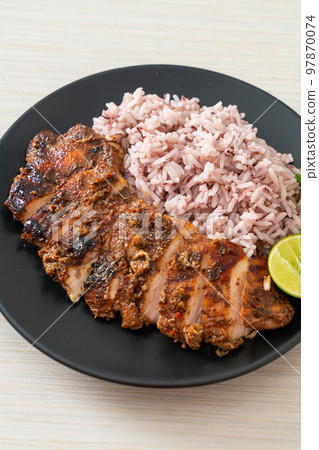 spicy grilled Jamaican jerk chicken with rice 97870074