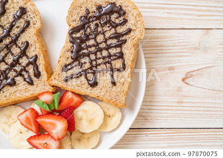 whole wheat bread with fresh banana, strawberry and chocolate 97870075
