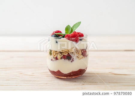 homemade raspberry and blueberry with yogurt and granola 97870080