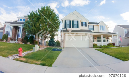 View of the typical suburban neighborhood on a summer morning. 97870128