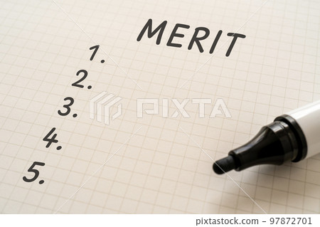 A piece of paper and a marker with MERIT and the numbers 1-5 written on it 97872701