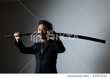 A bearded man holding a Japanese sword (suit version) 97873591