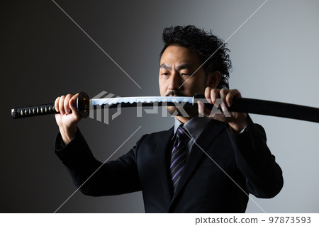 A bearded man holding a Japanese sword (suit version) A bearded man holding a Japanese sword (suit version) 97873593