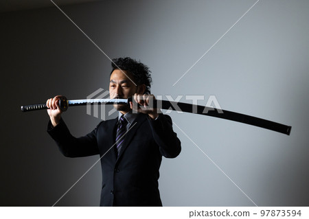 A bearded man holding a Japanese sword (suit version) A bearded man holding a Japanese sword (suit version) 97873594