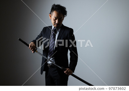 A bearded man holding a Japanese sword (suit version) A bearded man holding a Japanese sword (suit version) 97873602