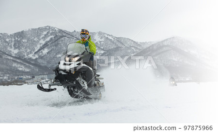 The Snowmobile in high jump above track. The Snowmobile in high jump above track. 97875966