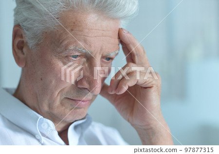 Portrait of sad sick old nice man with headache 97877315