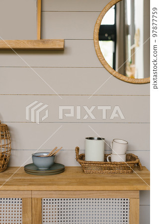 Kitchen details, accessories, ceramic mugs, wooden countertop, gray wooden boards wall background. Eco-friendly Scandinavian-style kitchen. Kitchen details, accessories, ceramic mugs, wooden countertop, gray wooden boards wall background. Eco-friendly Scandinavian-style kitchen. 97877759
