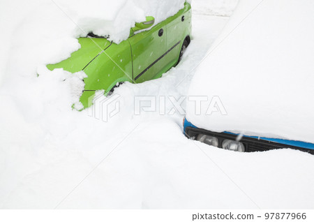 Cars in the snowdrift on the parking lot Cars in the snowdrift on the parking lot 97877966