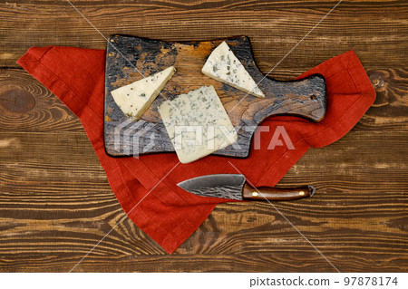 Overhead view of different types of blue cheese with mold 97878174