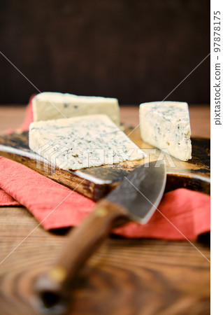 Photo with shallow depth of field of different types of blue cheese with mold Photo with shallow depth of field of different types of blue cheese with mold 97878175